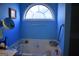 Tranquil bathroom with a large garden tub and window, offering a serene and relaxing experience at 213 Meridian Dr, Stockbridge, GA 30281