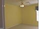 Bedroom with neutral carpet, walls, and ceiling fan at 213 Meridian Dr, Stockbridge, GA 30281