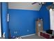 Bright blue bedroom with a large window for natural light and a simple, functional design at 213 Meridian Dr, Stockbridge, GA 30281