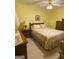 Cozy bedroom with warm yellow walls, traditional furnishings, and a ceiling fan at 213 Meridian Dr, Stockbridge, GA 30281