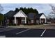 Exterior view of the community buildings with parking and well-kept landscaping at 213 Meridian Dr, Stockbridge, GA 30281