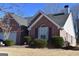 Attractive brick home with dark shutters, mature landscaping, and a well-kept lawn at 213 Meridian Dr, Stockbridge, GA 30281