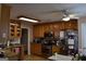 Spacious kitchen featuring oak cabinets and stainless steel appliances at 213 Meridian Dr, Stockbridge, GA 30281