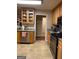 Kitchen with light wood cabinets, stainless steel appliances, and tile flooring at 213 Meridian Dr, Stockbridge, GA 30281