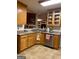 Bright kitchen with light wood cabinets, granite countertops, and stainless steel appliances at 213 Meridian Dr, Stockbridge, GA 30281
