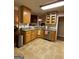 Traditional kitchen featuring wood cabinets, stainless steel appliances, and granite countertops at 213 Meridian Dr, Stockbridge, GA 30281