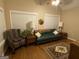 A cozy living room is decorated with lamps and a rug at 213 Meridian Dr, Stockbridge, GA 30281