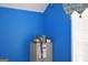Bright blue room with white blinds with filing cabinet at 213 Meridian Dr, Stockbridge, GA 30281