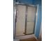 Shower enclosed with sleek sliding glass doors, combining functionality with modern design in the bathroom at 213 Meridian Dr, Stockbridge, GA 30281