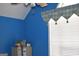 Bright blue room with white blinds and a decorative valance at 213 Meridian Dr, Stockbridge, GA 30281
