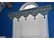 Window with white blinds and decorative valance in a room with blue walls at 213 Meridian Dr, Stockbridge, GA 30281