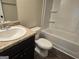 Clean bathroom with a shower/tub combo and granite countertop at 5711 Laney Dr # Ln24, Rex, GA 30273
