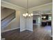 Bright dining room with chandelier and views into the kitchen at 5711 Laney Dr # Ln24, Rex, GA 30273