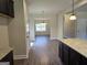 Open concept dining area with kitchen and living room views at 5711 Laney Dr # Ln24, Rex, GA 30273
