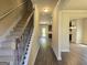 Spacious entryway with hardwood floors and staircase at 5711 Laney Dr # Ln24, Rex, GA 30273