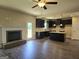 Open concept kitchen with island, fireplace, and hardwood floors at 5711 Laney Dr # Ln24, Rex, GA 30273