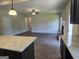Open living room with hardwood floors and a fireplace at 5711 Laney Dr # Ln24, Rex, GA 30273