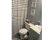 Clean bathroom with gray walls and a plaid shower curtain at 228 Cornell Ct, Villa Rica, GA 30180