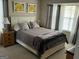 Comfortable bedroom with a neutral color palette and wooden furniture at 228 Cornell Ct, Villa Rica, GA 30180