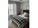 Cozy bedroom with a comfortable bed and black and white bedding at 228 Cornell Ct, Villa Rica, GA 30180