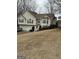 Two-story house with beige siding, two-car garage, and landscaping at 228 Cornell Ct, Villa Rica, GA 30180