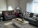 Living room with two sofas, coffee table, and fireplace at 228 Cornell Ct, Villa Rica, GA 30180