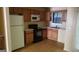 Functional kitchen with stainless steel appliances, wood cabinets and wood-look flooring at 2590 Wellington Walk Pl, Lithonia, GA 30058