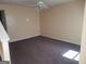 Simple living room with carpeted floors and neutral walls at 2590 Wellington Walk Pl, Lithonia, GA 30058