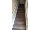 Carpeted staircase leading to the upper level at 2590 Wellington Walk Pl, Lithonia, GA 30058