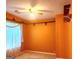 Bedroom with ceiling fan and window with sheer curtains at 6709 Biscayne Blvd, Rex, GA 30273