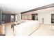 Finished basement with sectional sofa, large TV, and a pool table at 140 Alford Dr, Fayetteville, GA 30215