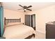 Cozy bedroom with a ceiling fan and ample space for a queen-sized bed at 140 Alford Dr, Fayetteville, GA 30215
