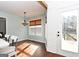Bright breakfast nook with hardwood floors, white shiplap walls and backyard access at 140 Alford Dr, Fayetteville, GA 30215