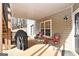 Covered patio with grill and seating area at 140 Alford Dr, Fayetteville, GA 30215