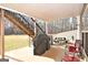 Covered patio with grill, table, and chairs at 140 Alford Dr, Fayetteville, GA 30215