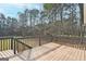 Deck with wooded views and railing at 140 Alford Dr, Fayetteville, GA 30215