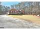 House exterior with driveway and landscaping at 140 Alford Dr, Fayetteville, GA 30215