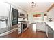 Updated kitchen featuring stainless steel appliances, white quartz countertops, and gray cabinets at 140 Alford Dr, Fayetteville, GA 30215