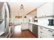 Modern kitchen with stainless steel appliances, white quartz countertops, and gray cabinets at 140 Alford Dr, Fayetteville, GA 30215