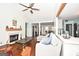 Spacious living room with hardwood floors, fireplace, and L-shaped sectional sofa at 140 Alford Dr, Fayetteville, GA 30215
