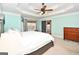 Bright main bedroom with a ceiling fan, large bed, and plenty of natural light at 140 Alford Dr, Fayetteville, GA 30215
