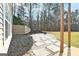 Stone patio with fire pit and privacy wall at 140 Alford Dr, Fayetteville, GA 30215