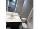 Bathroom with dark vanity, toilet and bathtub at 1340 Napa Valley Dr, Lawrenceville, GA 30045