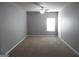Simple bedroom with neutral walls and carpet at 1340 Napa Valley Dr, Lawrenceville, GA 30045