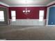 Formal dining room with red walls, wainscoting, and a chandelier at 1340 Napa Valley Dr, Lawrenceville, GA 30045