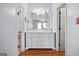 Clean bathroom with double vanity and marble countertops at 6051 Reynolds Rd, Morrow, GA 30260