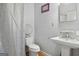 Bathroom with pedestal sink and shower/tub combo at 6051 Reynolds Rd, Morrow, GA 30260