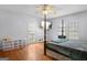 Spacious bedroom with hardwood floors and a view of the backyard at 6051 Reynolds Rd, Morrow, GA 30260