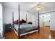 Large bedroom with ensuite bathroom access and hardwood floors at 6051 Reynolds Rd, Morrow, GA 30260