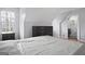 Serene bedroom with ensuite bathroom and hardwood floors at 6051 Reynolds Rd, Morrow, GA 30260